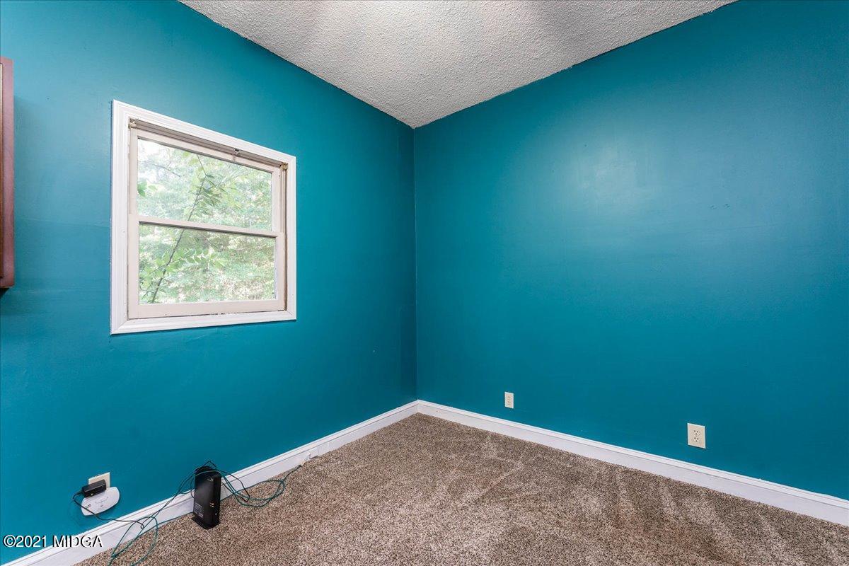 455 Lite-N-Tie Road Gray, GA 31032 - Photo 33 of 47 an empty room with windows