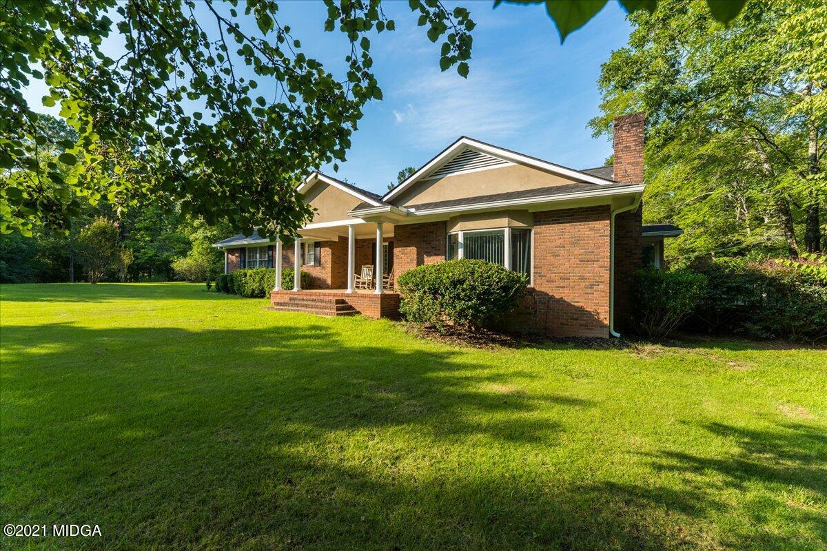 455 Lite-N-Tie Road Gray, GA 31032 - Photo 5 of 47 a front view of a house with yard and green space