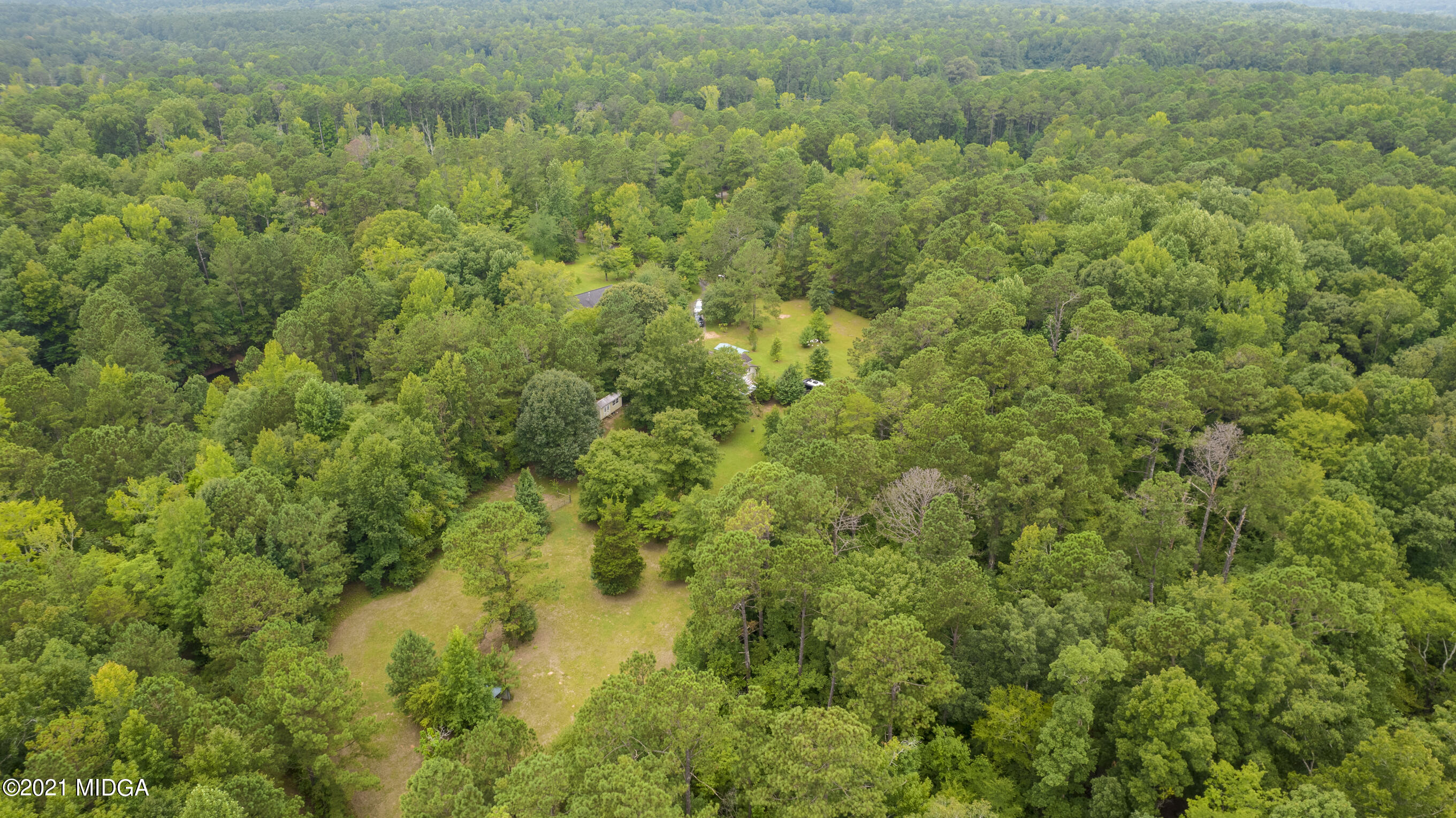 455 Lite-N-Tie Road Gray, GA 31032 - Photo 44 of 47 a view of a forest with a street