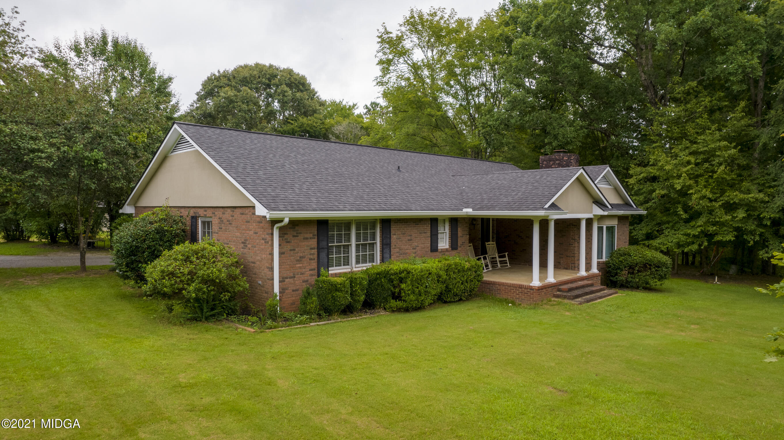 455 Lite-N-Tie Road Gray, GA 31032 - Photo 45 of 47 a front view of a house with garden
