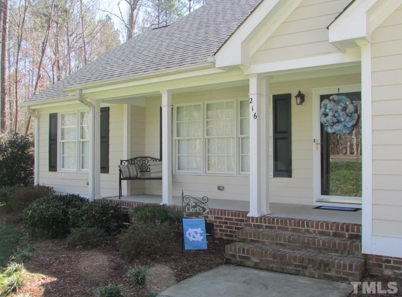 216 Piney Forest Road Roxboro, NC 27574 - Photo 2 of 23 Front porch offers morning sun and evening shade