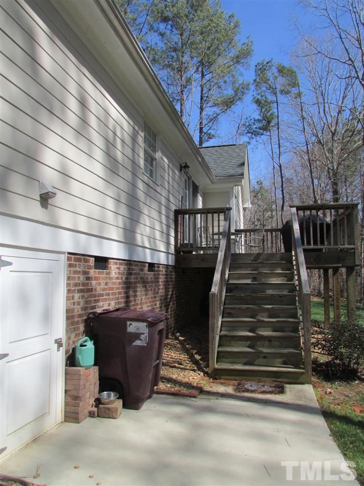 216 Piney Forest Road Roxboro, NC 27574 - Photo 17 of 23 Access door to underneath house, sidewalk, deck, fiber cement siding, everything has been well maintained by the seller.