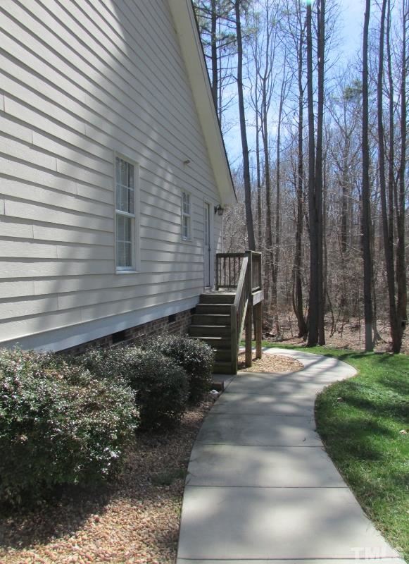 216 Piney Forest Road Roxboro, NC 27574 - Photo 18 of 23 The side entry that leads to the utility room and the rear deck has a sidewalk.