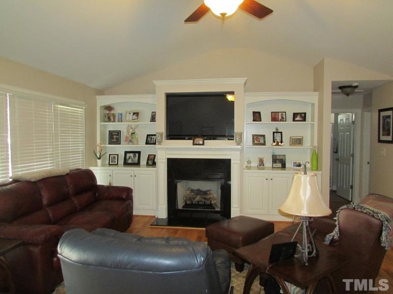 216 Piney Forest Road Roxboro, NC 27574 - Photo 3 of 23 Family room has vaulted ceiling, gas log fireplace, tv niche