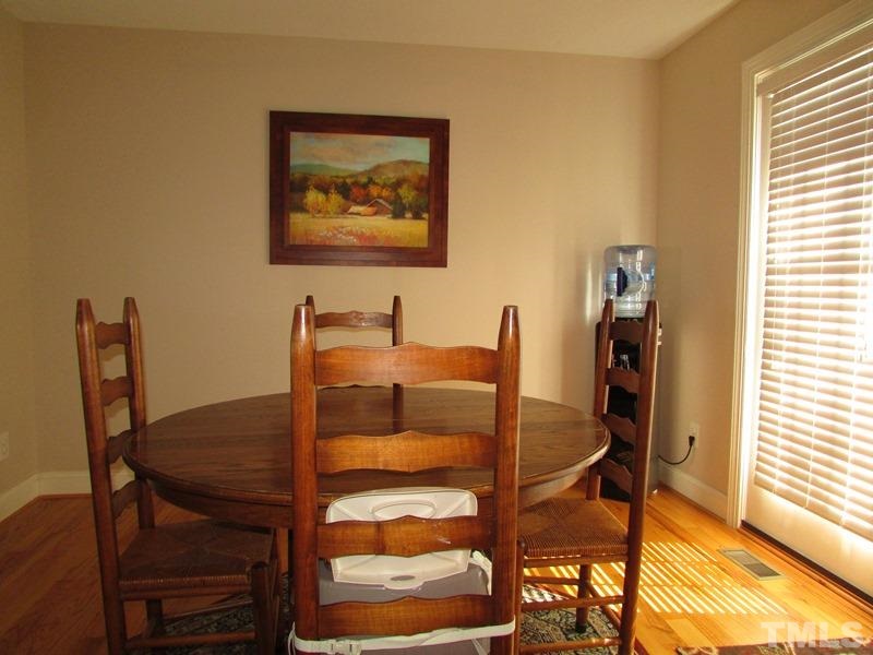 216 Piney Forest Road Roxboro, NC 27574 - Photo 8 of 23 Dining area is open to the kitchen as well as the family room. Garden door to rear deck.