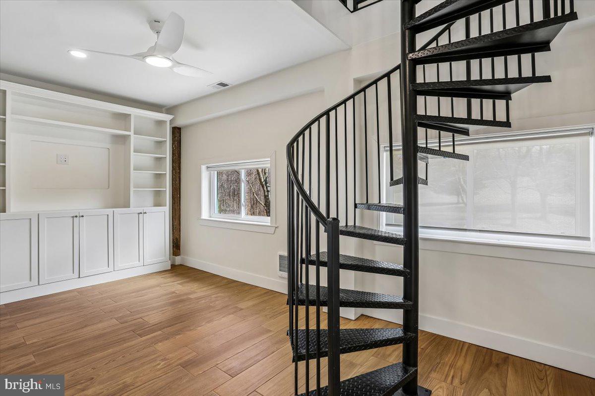 24875 Old Hundred Road Dickerson, MD 20842 - Photo 33 of 47 Spiral Staircase to Upper Level