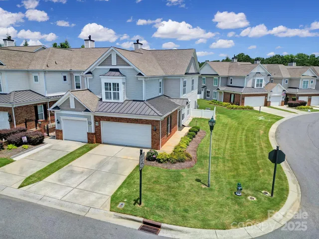 a aerial view of a house with a garden and plants