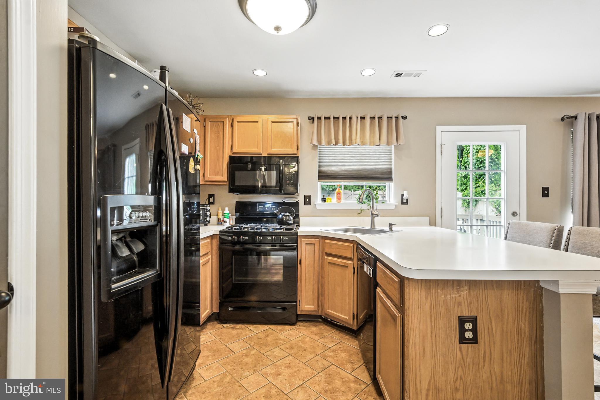 86 Pondview Lane Sicklerville, NJ 08081 - Photo 13 of 35 a kitchen with stainless steel appliances granite countertop a refrigerator sink and stove