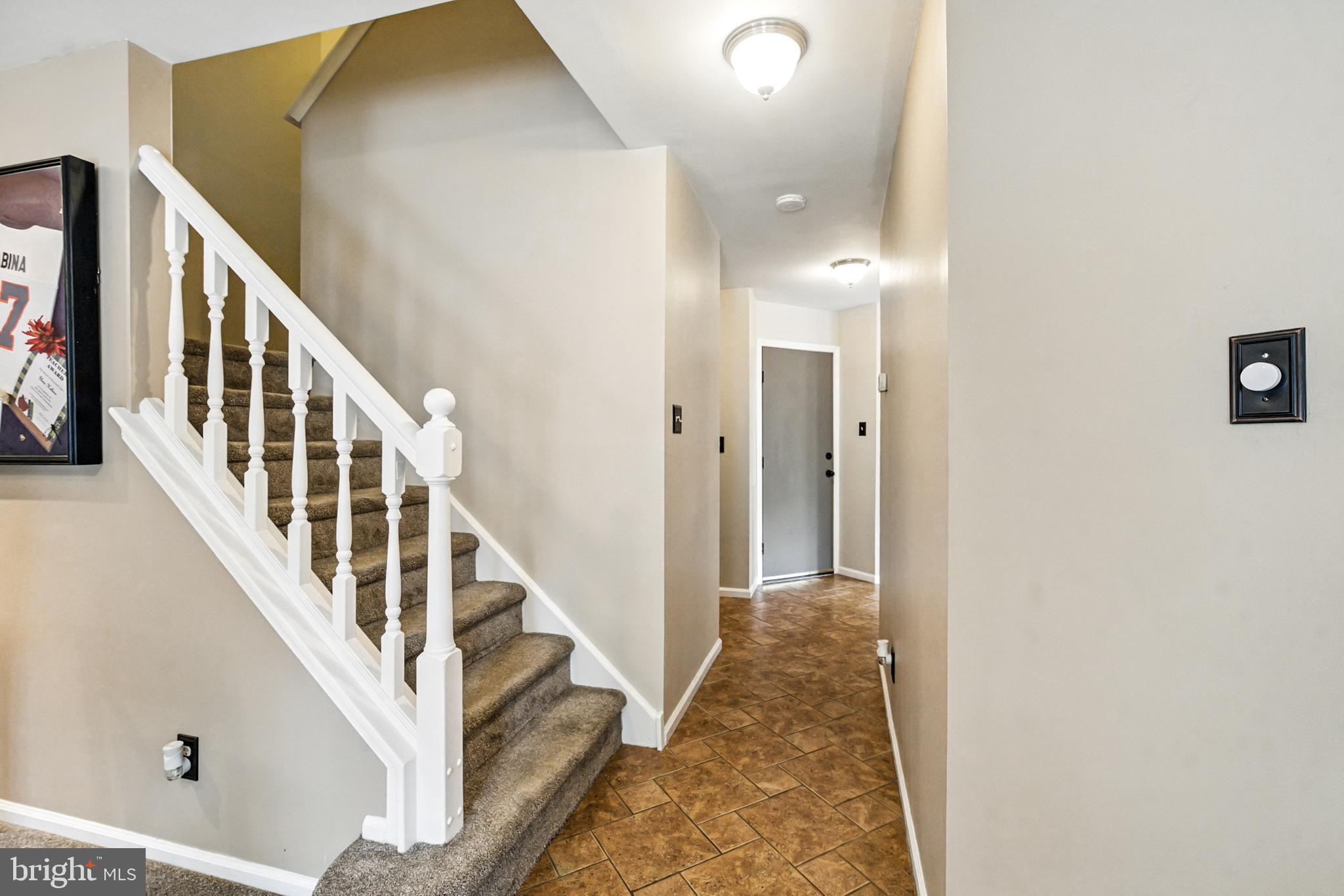 86 Pondview Lane Sicklerville, NJ 08081 - Photo 19 of 35 a view of a hallway with wooden floor and staircase