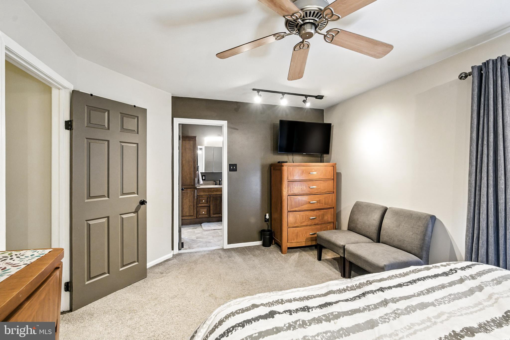 86 Pondview Lane Sicklerville, NJ 08081 - Photo 28 of 35 a bedroom with a bed and a flat tv screen