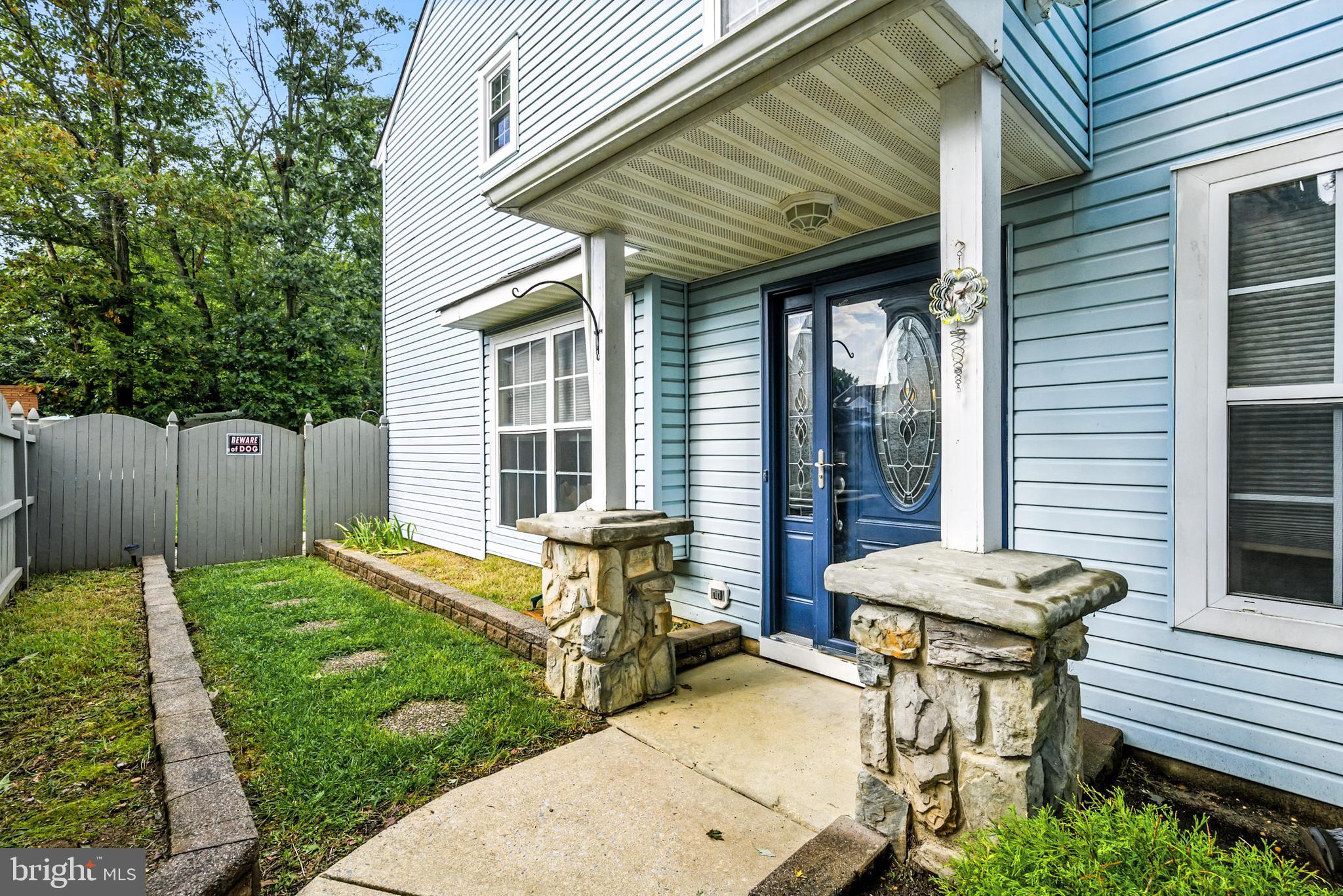 86 Pondview Lane Sicklerville, NJ 08081 - Photo 4 of 35 a view of a backyard with chairs and a table