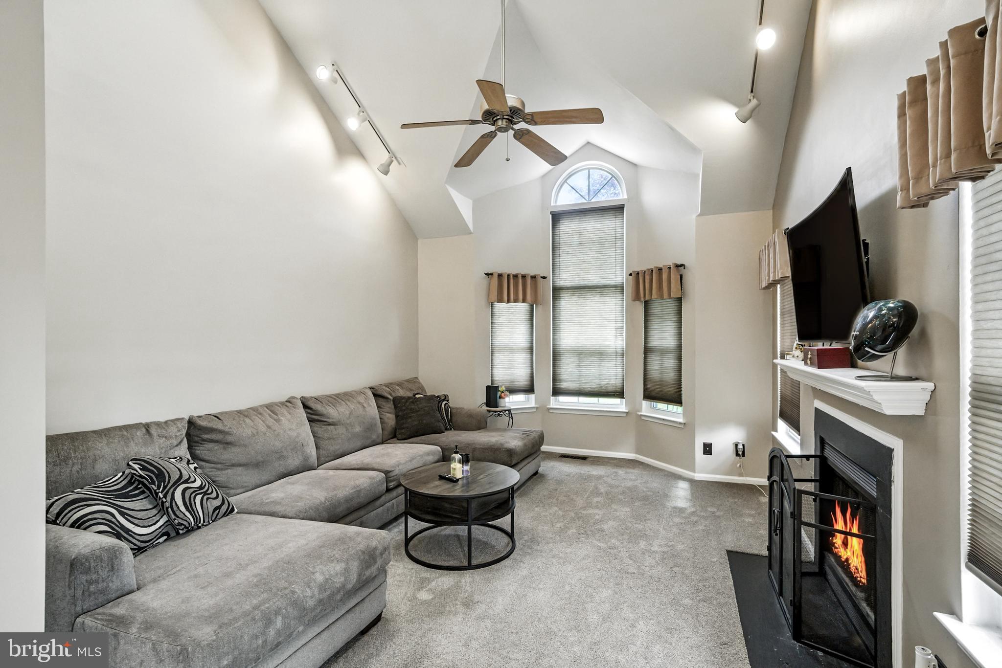 86 Pondview Lane Sicklerville, NJ 08081 - Photo 7 of 35 a living room with furniture and a flat screen tv