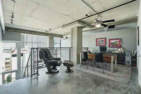 a view of a terrace with couches and wooden floor
