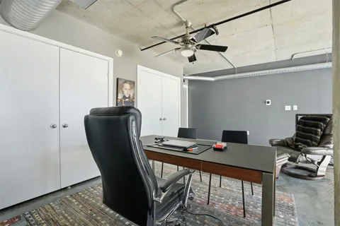 a view of a terrace with a table and chairs