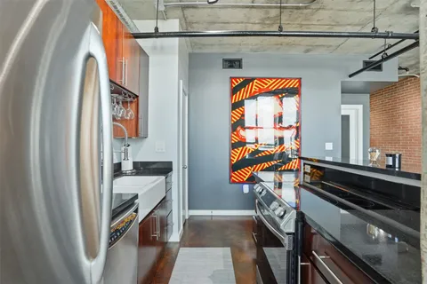 a bathroom with a shower and a glass door