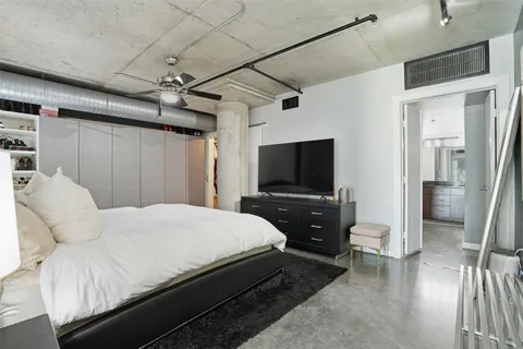 a view of a workspace with furniture and gym equipment