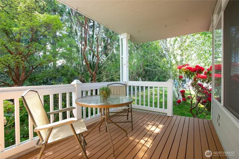 a view of a chairs on wooden deck
