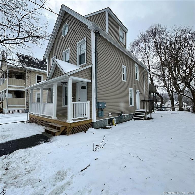 42 Prospect Street, Unit 1 Wallingford, CT 06492 - Photo 1 of 1 a view of a house with a yard