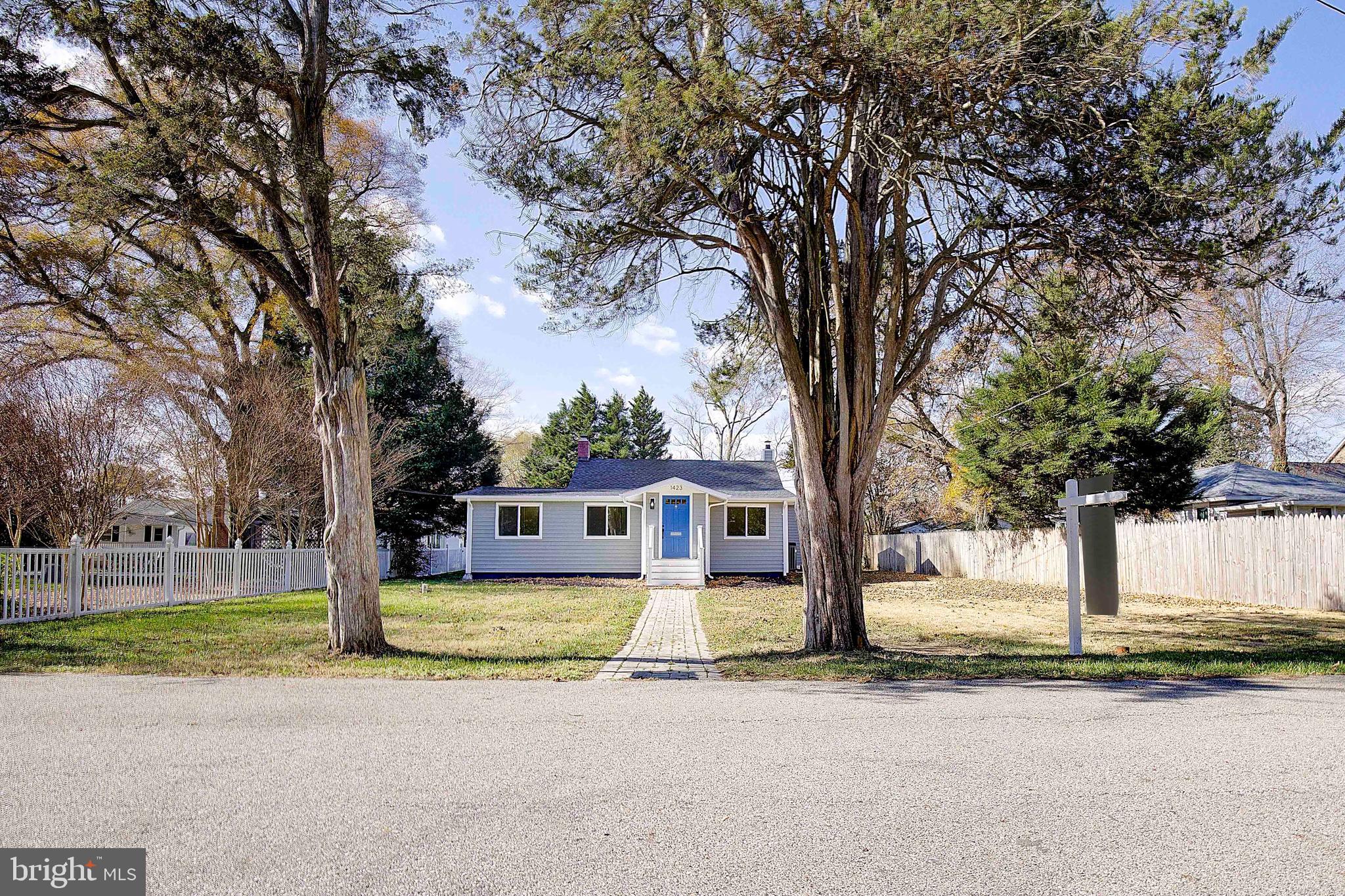 1423 Park Road Edgewater, MD 21037 - Photo 1 of 40 a front view of a house with a yard and trees