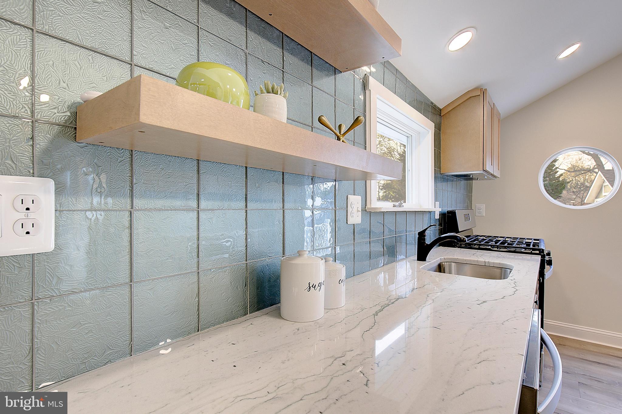 1423 Park Road Edgewater, MD 21037 - Photo 14 of 40 a bathroom with a sink and a mirror