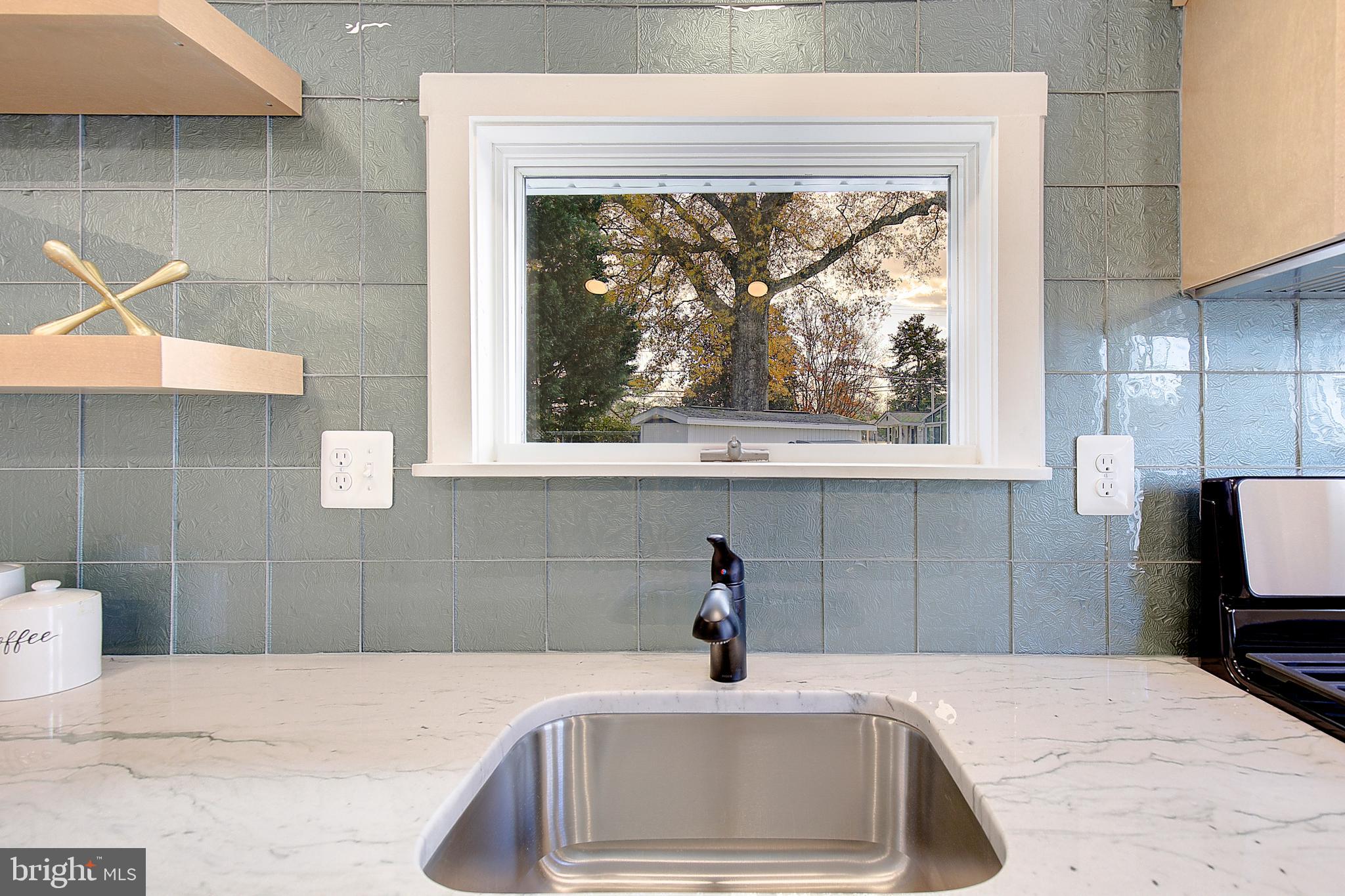 1423 Park Road Edgewater, MD 21037 - Photo 16 of 40 a bathroom with a sink and a window
