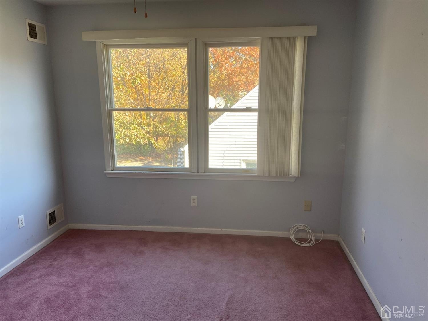 1602 Oak Tree Road Iselin, NJ 08830 - Photo 11 of 13 an empty room with a window