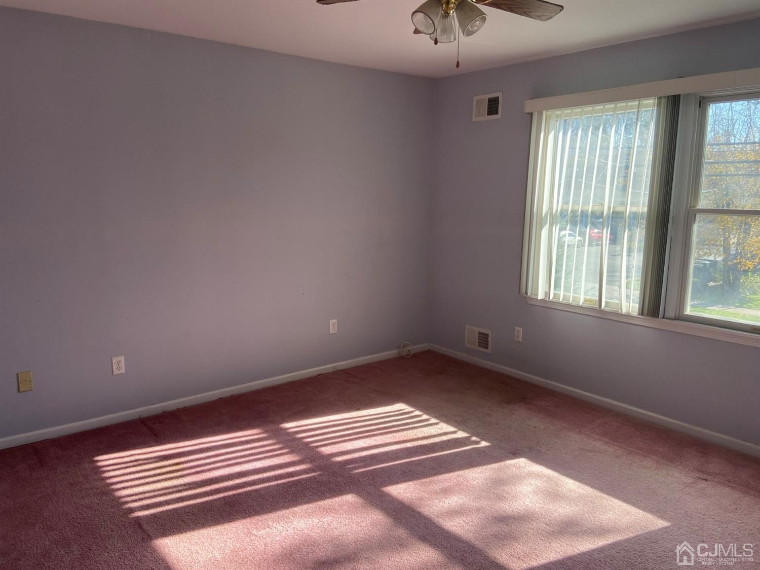 1602 Oak Tree Road Iselin, NJ 08830 - Photo 9 of 13 a view of empty room with windows