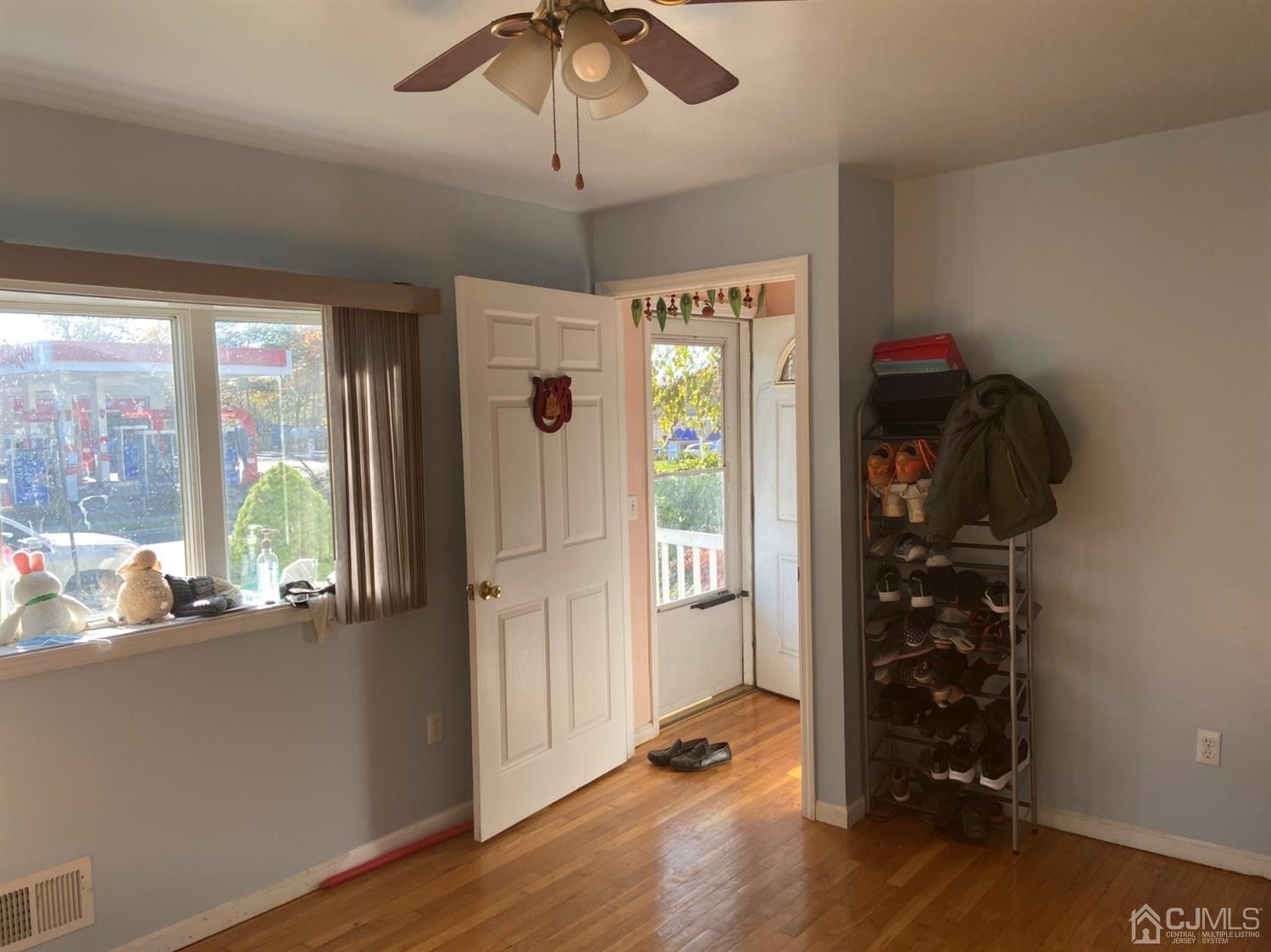 1602 Oak Tree Road Iselin, NJ 08830 - Photo 10 of 13 a view of room with window and hardwood floor