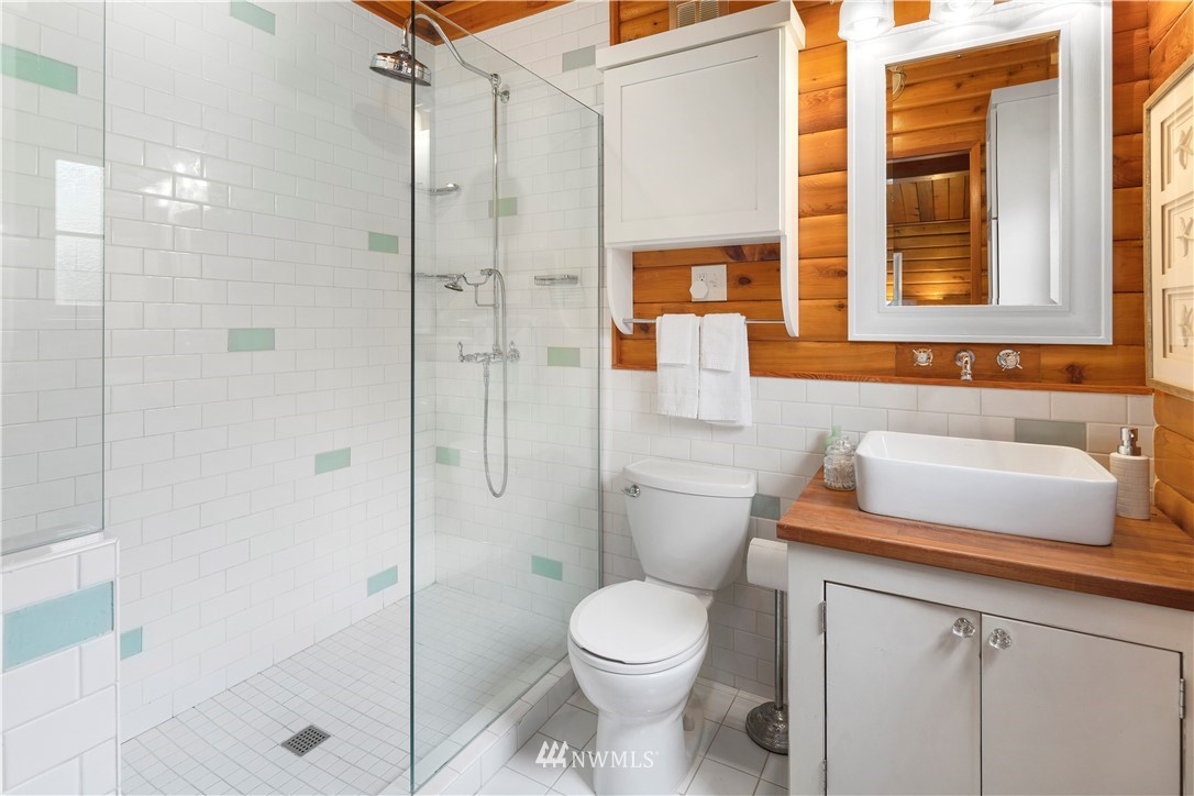 14255 183rd Avenue Southeast Renton, WA 98059 - Photo 18 of 32 a bathroom with a sink toilet and shower