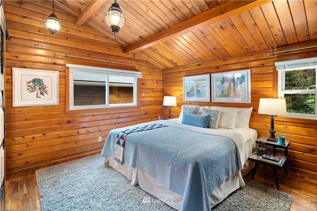 14255 183rd Avenue Southeast Renton, WA 98059 - Photo 19 of 32 a bedroom with a bed and wooden floor