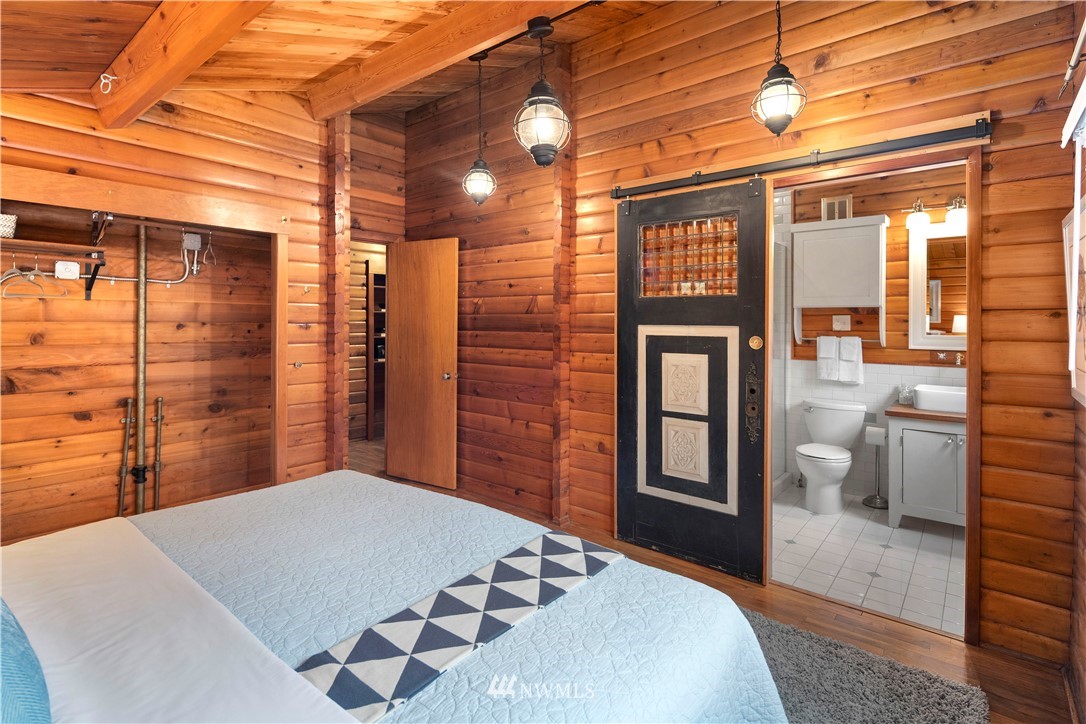 14255 183rd Avenue Southeast Renton, WA 98059 - Photo 20 of 32 a bedroom with a bed and wooden floor