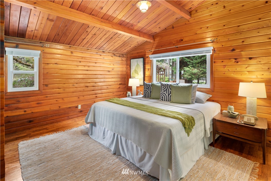 14255 183rd Avenue Southeast Renton, WA 98059 - Photo 21 of 32 a bedroom with a bed and wooden floor