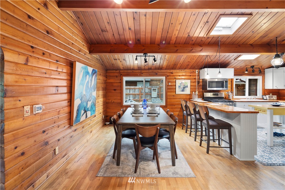 14255 183rd Avenue Southeast Renton, WA 98059 - Photo 9 of 32 a view of a dining room with furniture window and wooden floor
