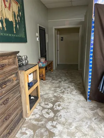 a living room with washer and dryer