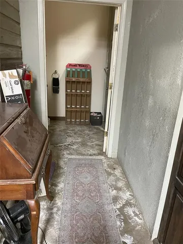 a view of an empty room and wooden floor