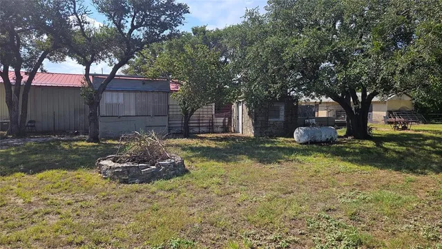 a house covered with tall trees