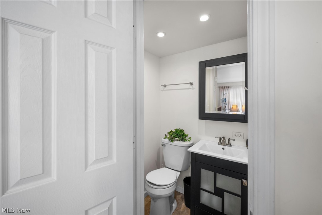 1623 Northeast Catawba Road, Unit 160 Port Clinton, OH 43452 - Photo 20 of 28 Half bath with vanity, toilet and recessed lighting