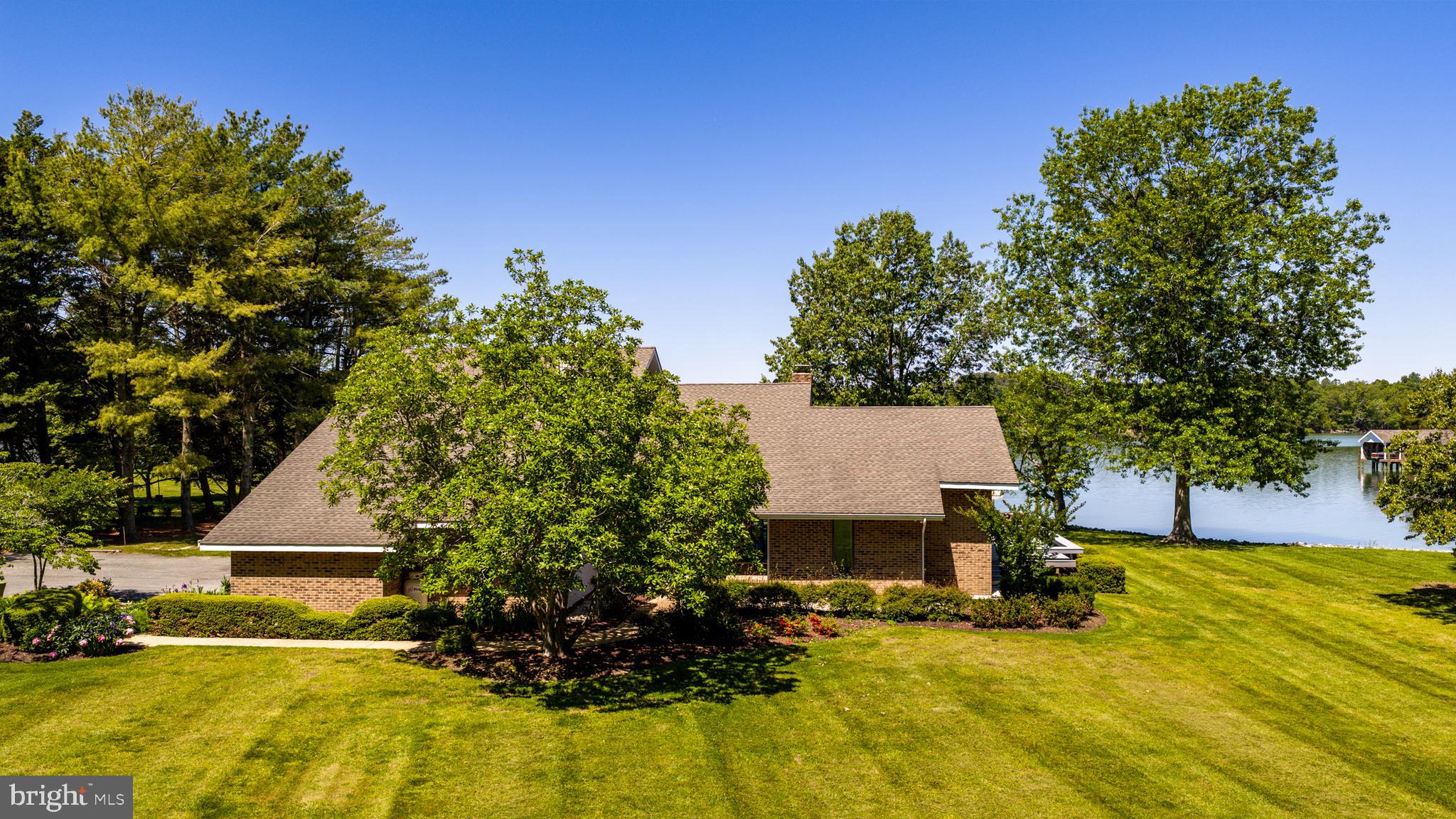 26282 Deep Water Harbor Road Easton, MD 21601 - Photo 40 of 53 a view of a house with a yard