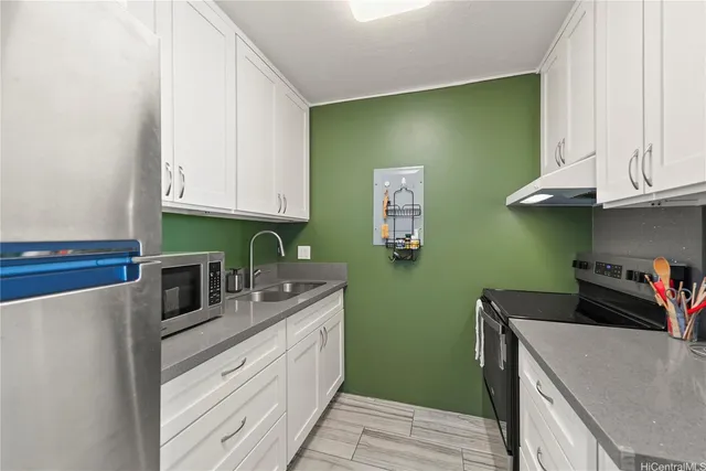 a kitchen with cabinets a sink and dishwasher
