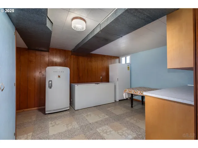 a view of storage and utility room with a washer dryer
