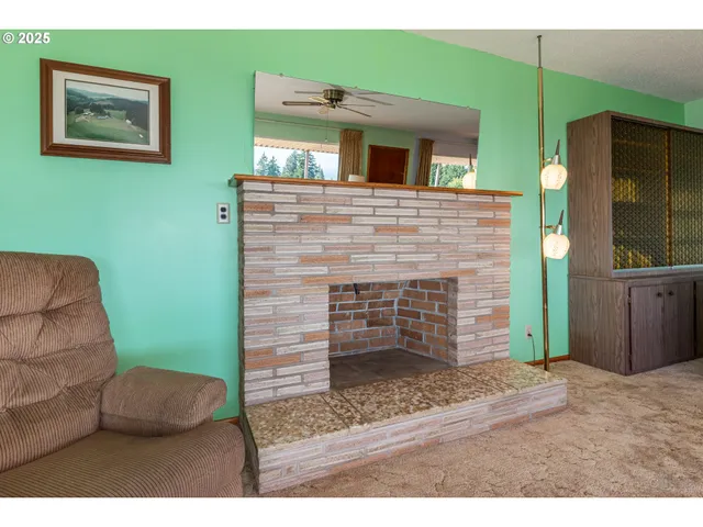 a living room with a couch and a fireplace