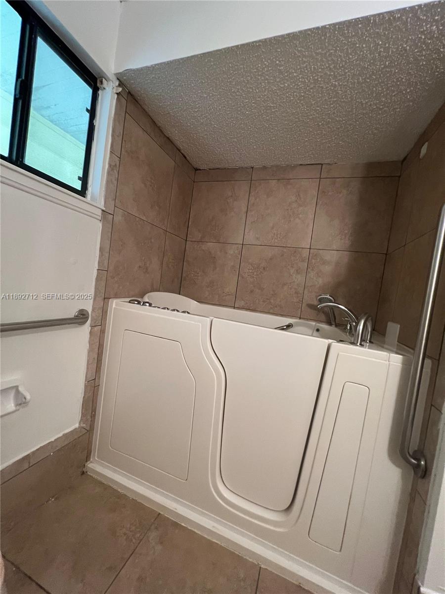 8935 Southwest 104th Place Ocala, FL 34481 - Photo 17 of 21 a utility room with dryer and washer