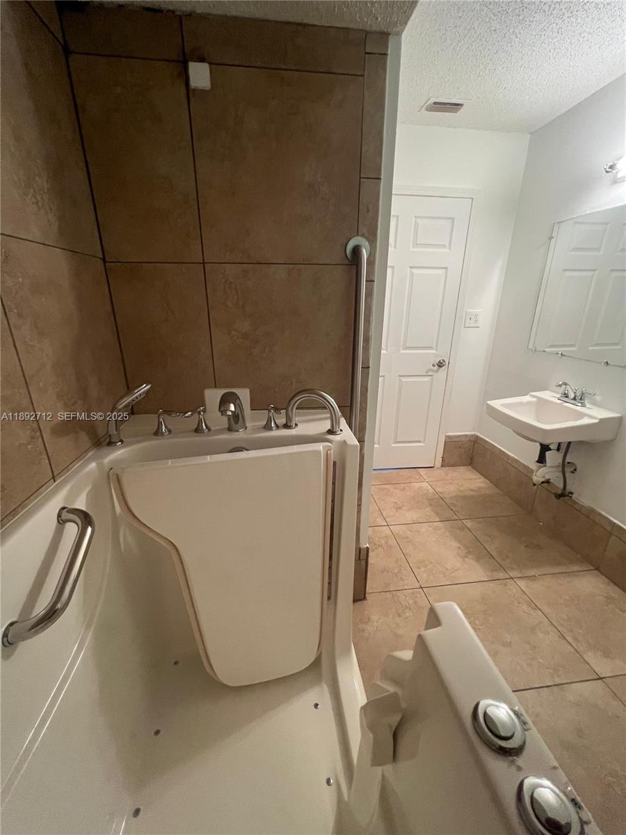 8935 Southwest 104th Place Ocala, FL 34481 - Photo 19 of 21 a utility room with dryer and washer