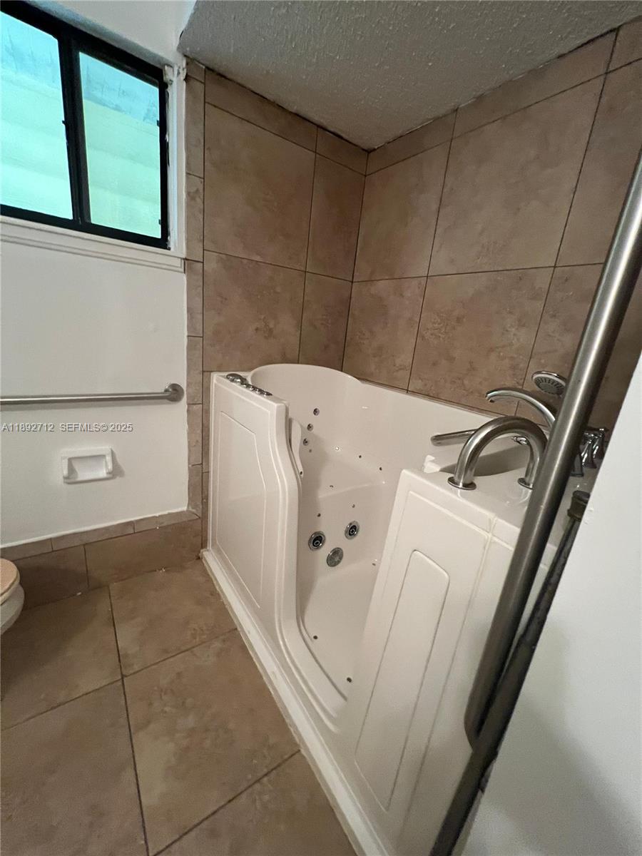 8935 Southwest 104th Place Ocala, FL 34481 - Photo 20 of 21 a utility room with dryer and washer