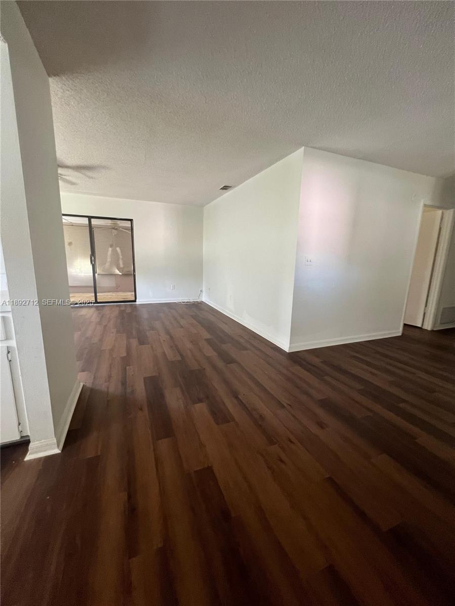 8935 Southwest 104th Place Ocala, FL 34481 - Photo 7 of 21 a view of empty room with wooden floor