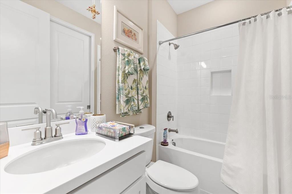 6236 Grandview Hill Court Bradenton, FL 34203 - Photo 11 of 16 a bathroom with a granite countertop sink toilet and shower