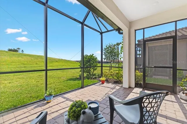 a view of a balcony with chair and table