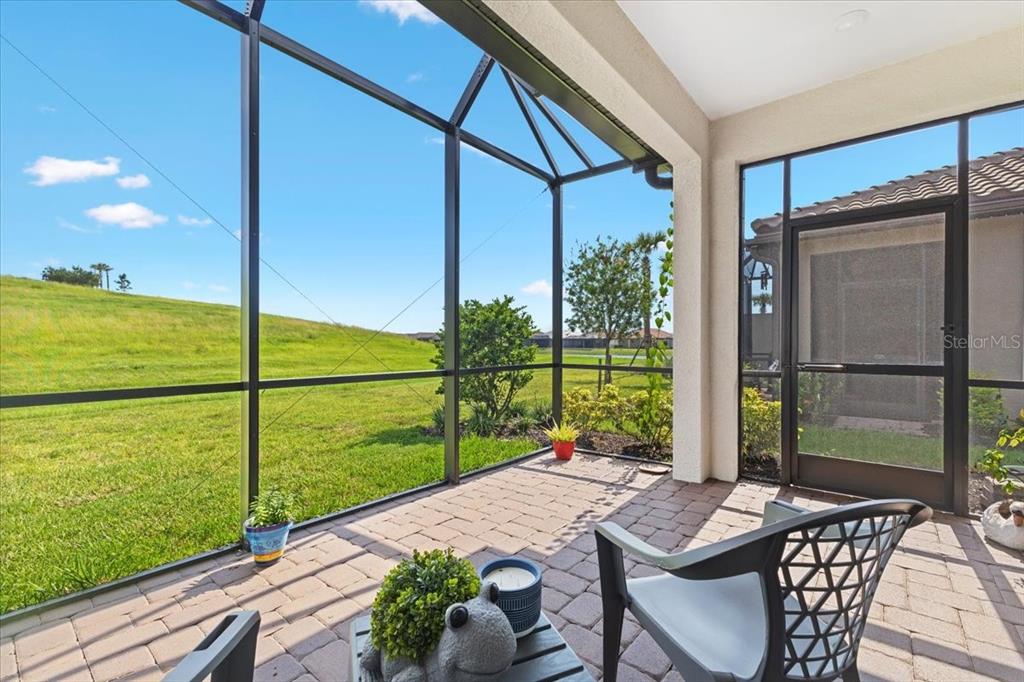 6236 Grandview Hill Court Bradenton, FL 34203 - Photo 13 of 16 a view of a balcony with chair and table