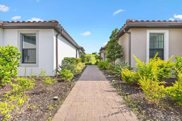 a view of a house with a yard and plants