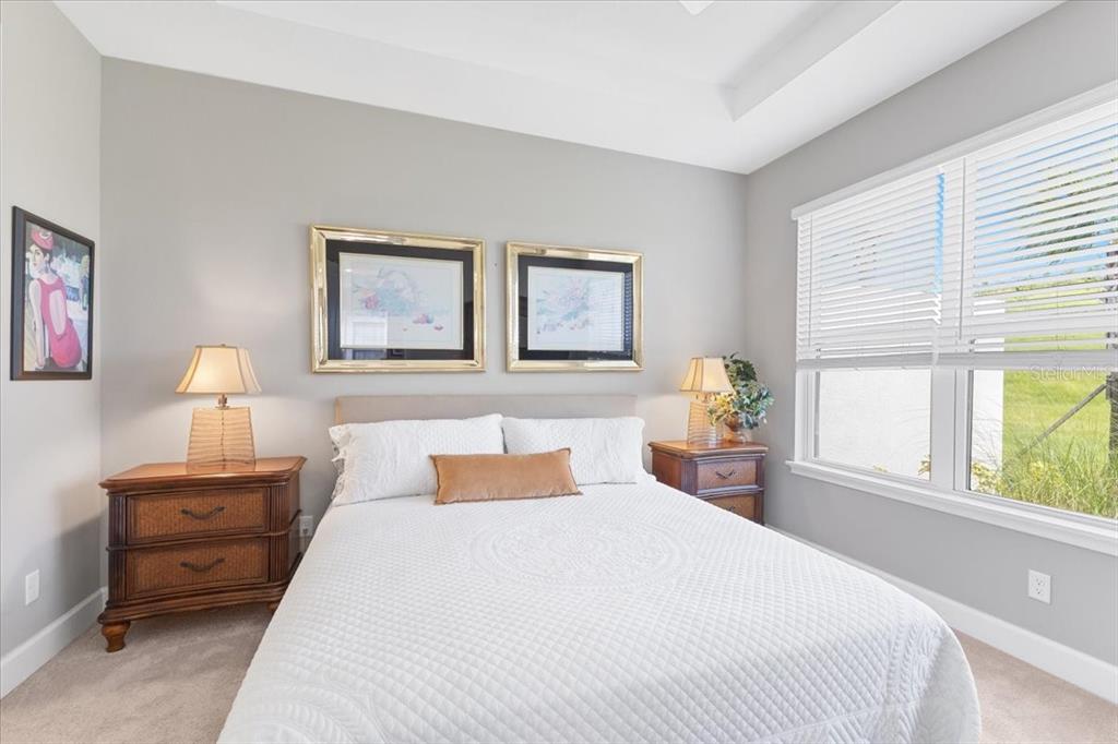 6236 Grandview Hill Court Bradenton, FL 34203 - Photo 7 of 16 a bedroom with a bed and a large window